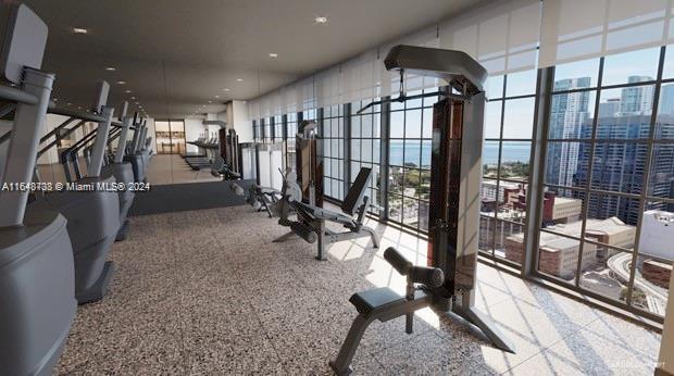 601 NE 1st Ave Unit 3101, Miami, FL 33132 - workout area with a wall of windows and a city view