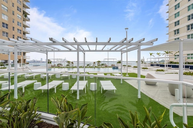 view of community featuring a pergola and a water view