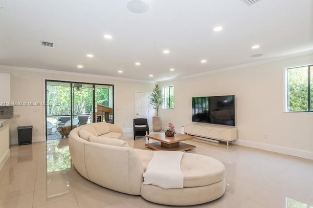 living room featuring ornamental molding and light tile patterned floors