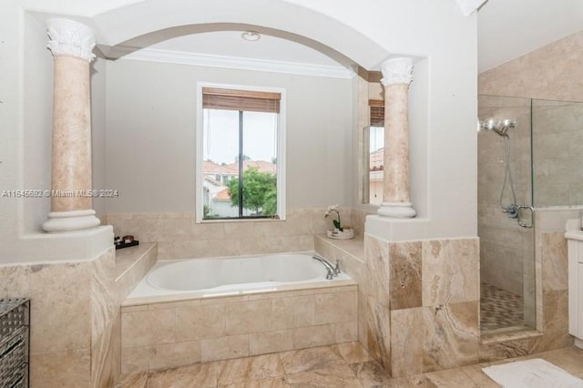 bathroom with decorative columns, crown molding, and independent shower and bath