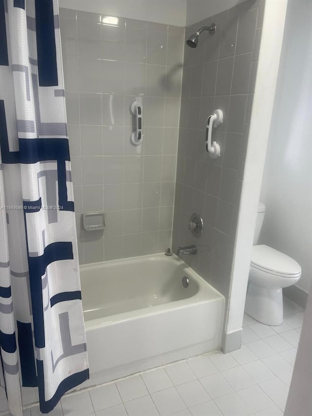 bathroom with tile patterned flooring, toilet, and shower / bathtub combination with curtain