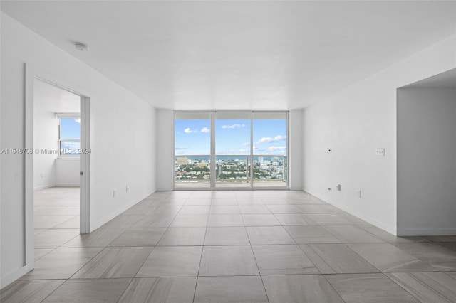 empty room featuring expansive windows