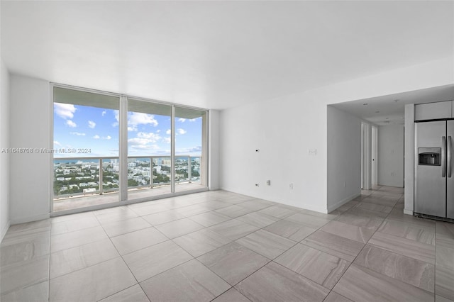 spare room featuring expansive windows