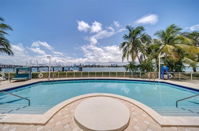 view of pool with a water view