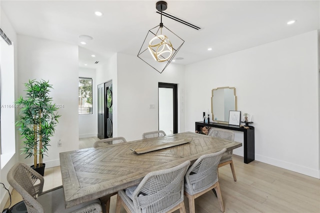 dining room with light wood-type flooring