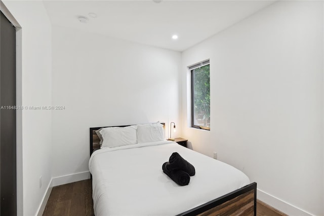 bedroom featuring dark hardwood / wood-style flooring