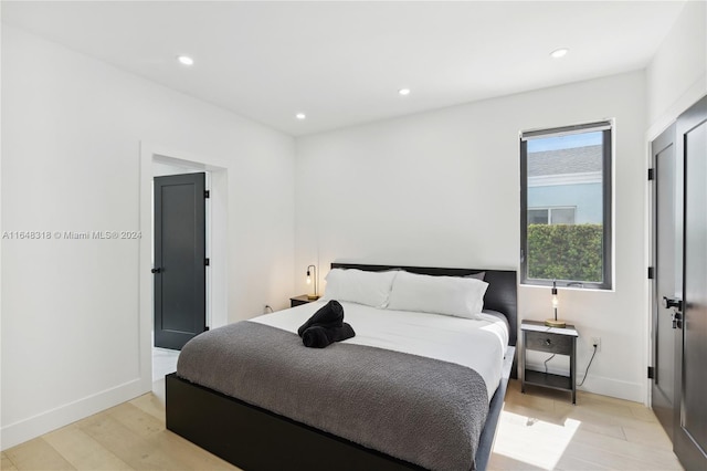 bedroom with light hardwood / wood-style flooring