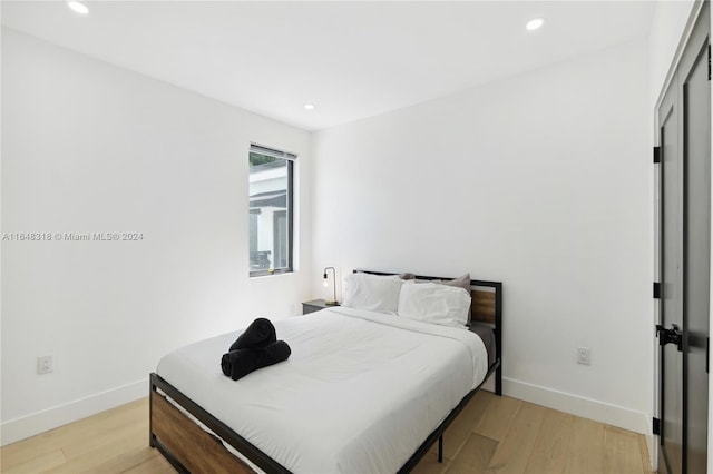 bedroom with light hardwood / wood-style flooring