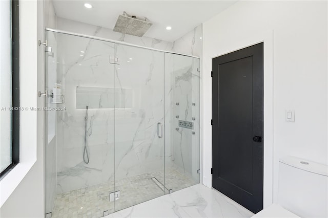 bathroom featuring toilet, an enclosed shower, and tile patterned flooring