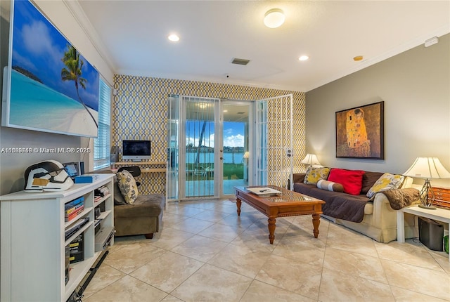 living room featuring recessed lighting, ornamental molding, wallpapered walls, and visible vents