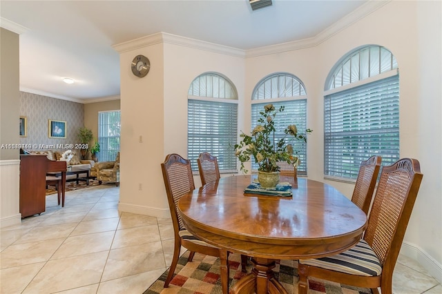 dining space featuring visible vents, ornamental molding, baseboards, wallpapered walls, and light tile patterned floors