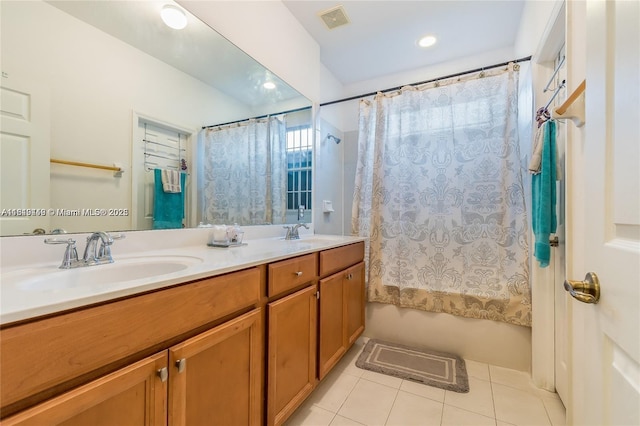 bathroom featuring a sink, tile patterned flooring, shower / bath combo with shower curtain, and visible vents