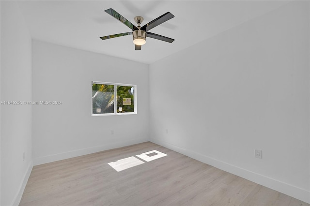 unfurnished room with ceiling fan and light hardwood / wood-style flooring