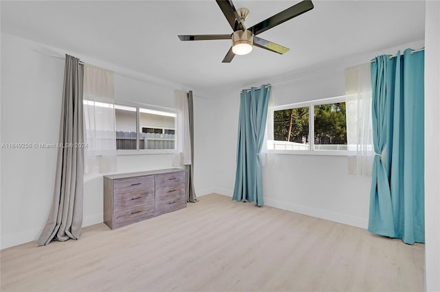 unfurnished bedroom with light wood-type flooring and ceiling fan