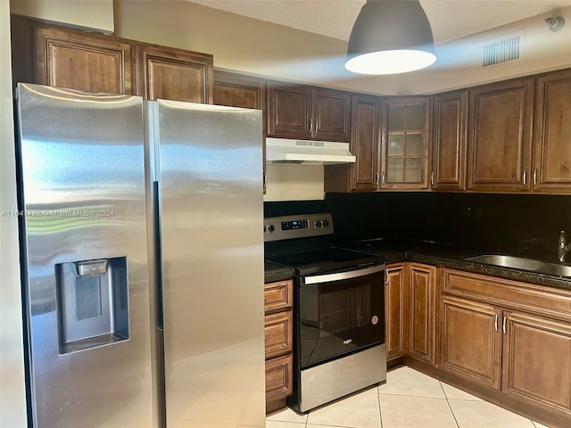 kitchen featuring sink, light tile patterned floors, and appliances with stainless steel finishes