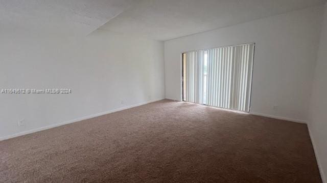 empty room with carpet flooring