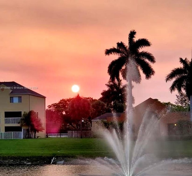 view of property's community with a yard