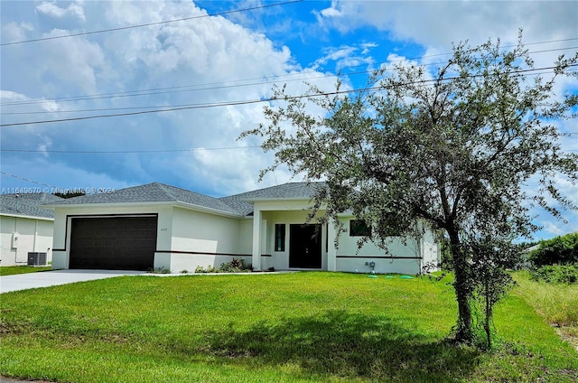 view of front of house with a garage, a front lawn, and central air condition unit