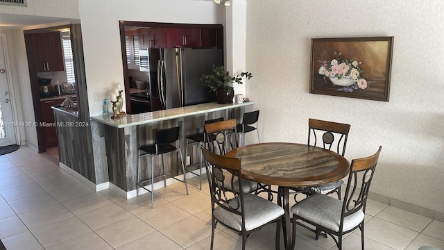 view of tiled dining space