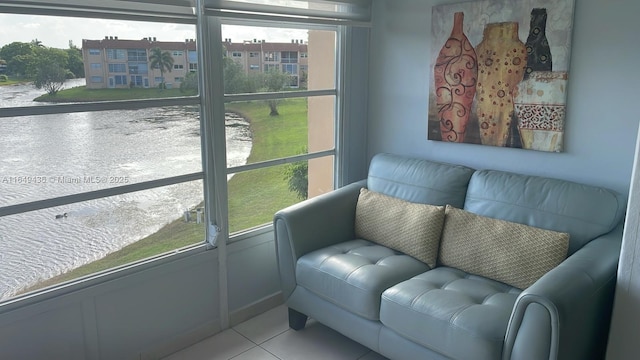 living area with tile patterned floors