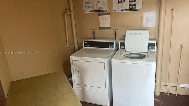 shared laundry area featuring washer and clothes dryer