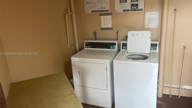 clothes washing area featuring separate washer and dryer