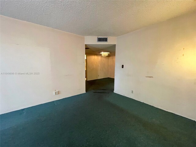 3000 NE 5th Ter Unit 310-A, Wilton Manors, FL 33334 - carpeted spare room with a textured ceiling