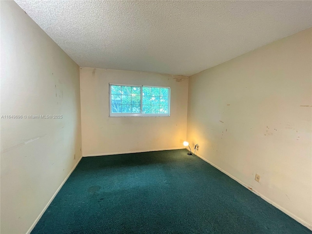 3000 NE 5th Ter Unit 310-A, Wilton Manors, FL 33334 - carpeted spare room with a textured ceiling and baseboards