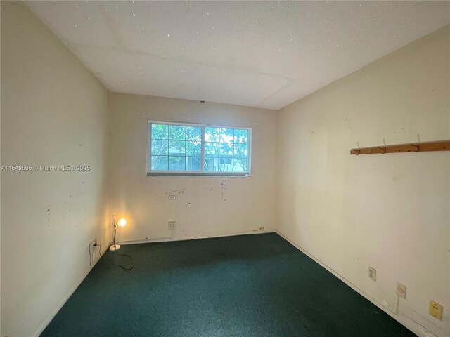 3000 NE 5th Ter Unit 310-A, Wilton Manors, FL 33334 - unfurnished room with dark carpet