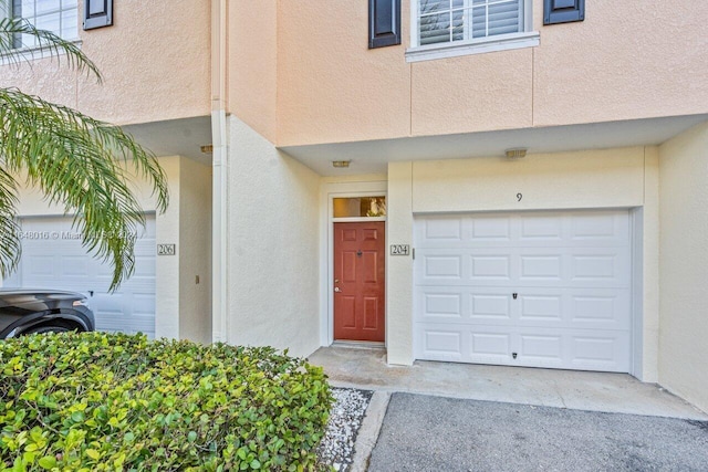 property entrance with a garage