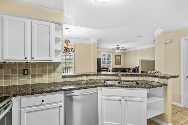 kitchen featuring ornamental molding, ceiling fan with notable chandelier, backsplash, light tile patterned floors, and stainless steel dishwasher