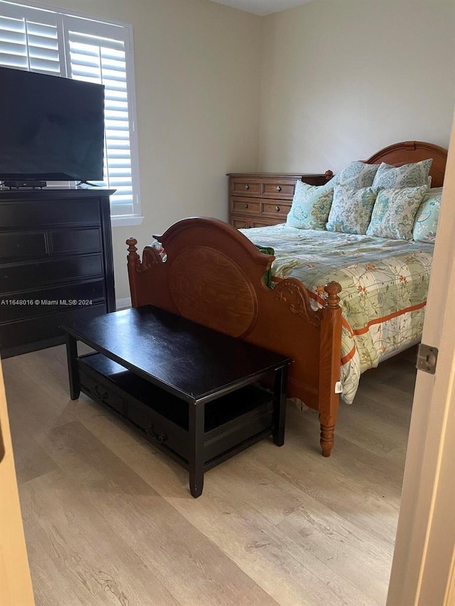 bedroom with light hardwood / wood-style floors