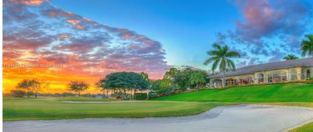 view of property's community featuring a yard