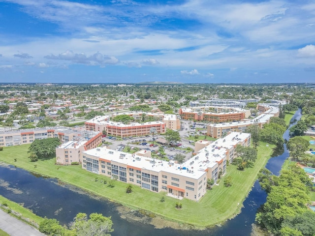 birds eye view of property featuring a water view and a view of city