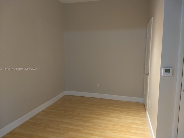 spare room with light hardwood / wood-style flooring