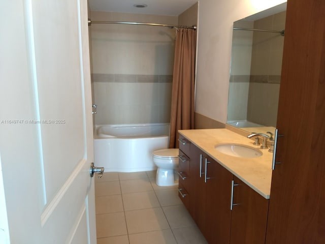 full bathroom featuring vanity, shower / tub combo, tile patterned floors, and toilet