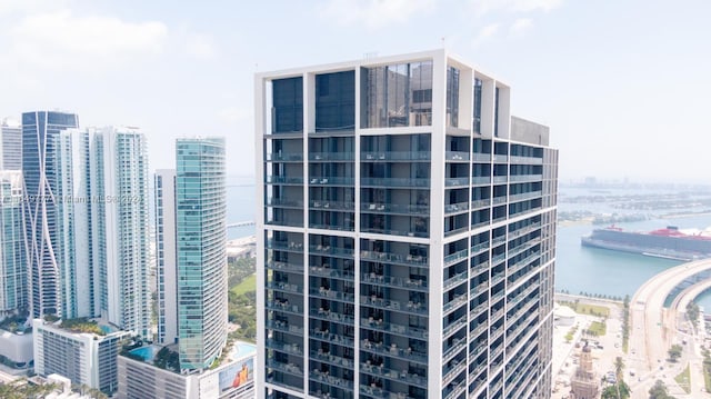 view of property featuring a view of city and a water view