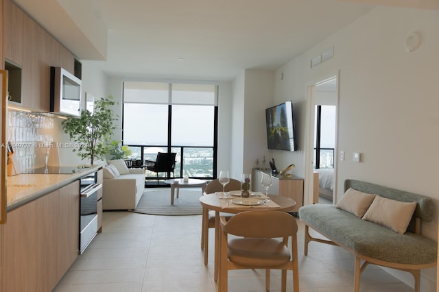 dining area with light tile patterned floors