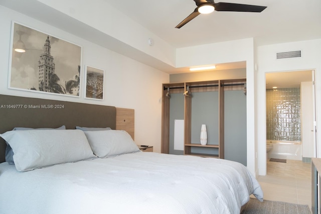 bedroom featuring visible vents, ceiling fan, tile patterned flooring, a closet, and ensuite bathroom