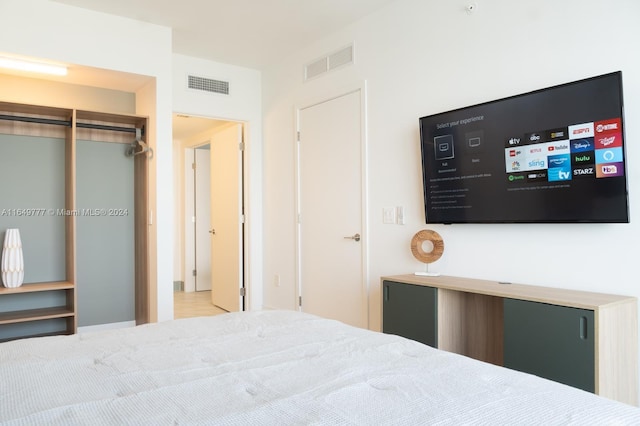 unfurnished bedroom featuring visible vents and a closet