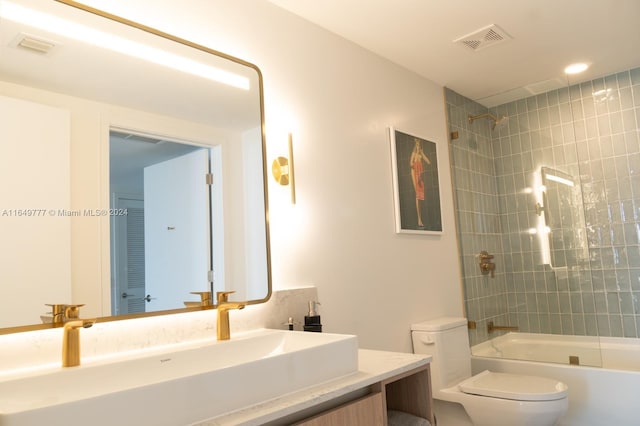 full bathroom featuring bathing tub / shower combination, visible vents, toilet, and vanity