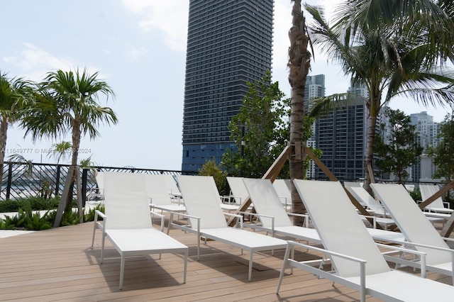 wooden deck featuring a city view