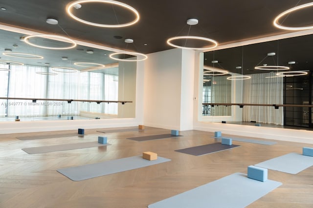 gym with parquet flooring