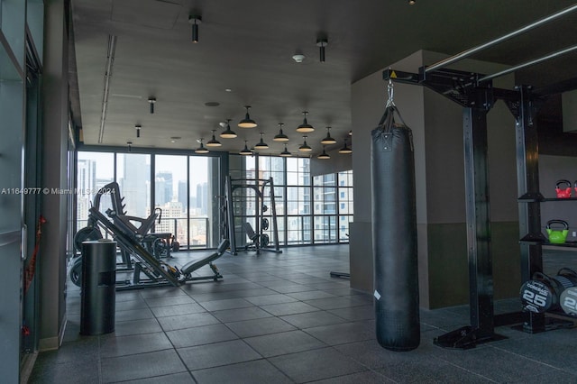 gym with a wall of windows