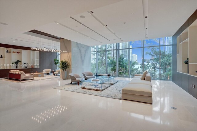 exercise room with a water view, expansive windows, and wood ceiling