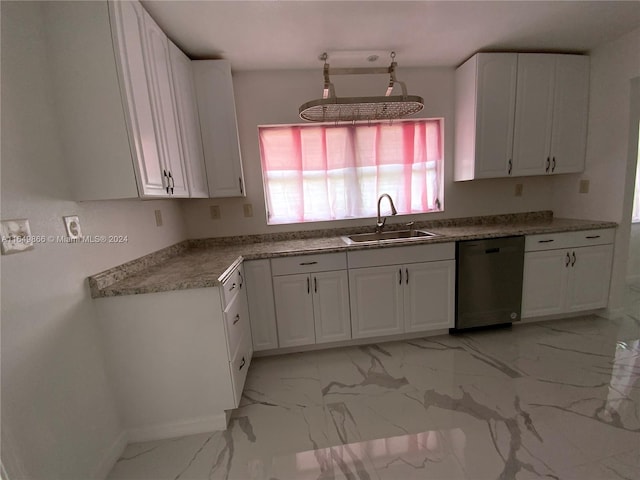 kitchen with dishwasher, sink, white cabinets, and light tile patterned flooring