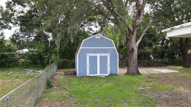 view of outdoor structure featuring a lawn