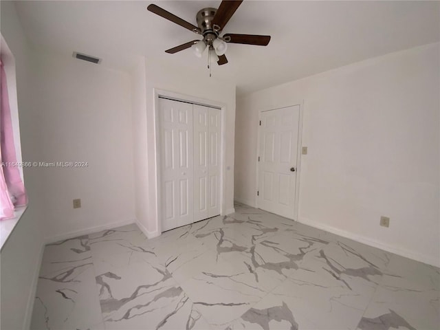 unfurnished bedroom featuring a closet, ceiling fan, and light tile patterned floors