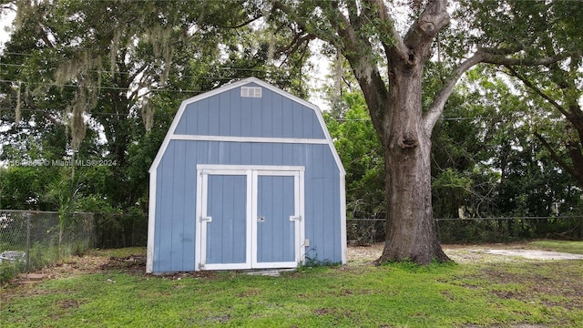 view of outbuilding with a lawn