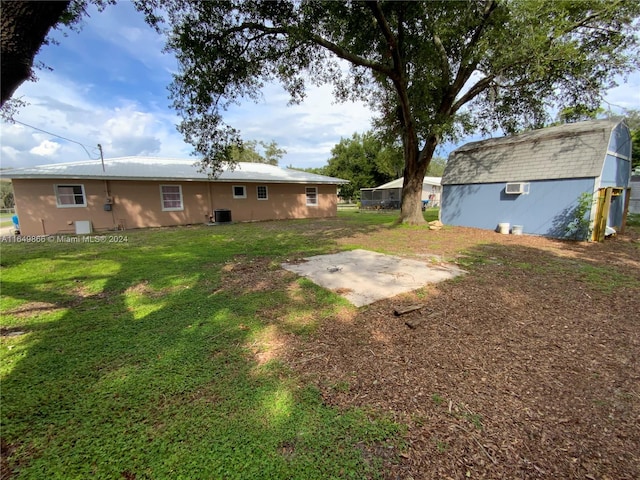 view of yard featuring central AC